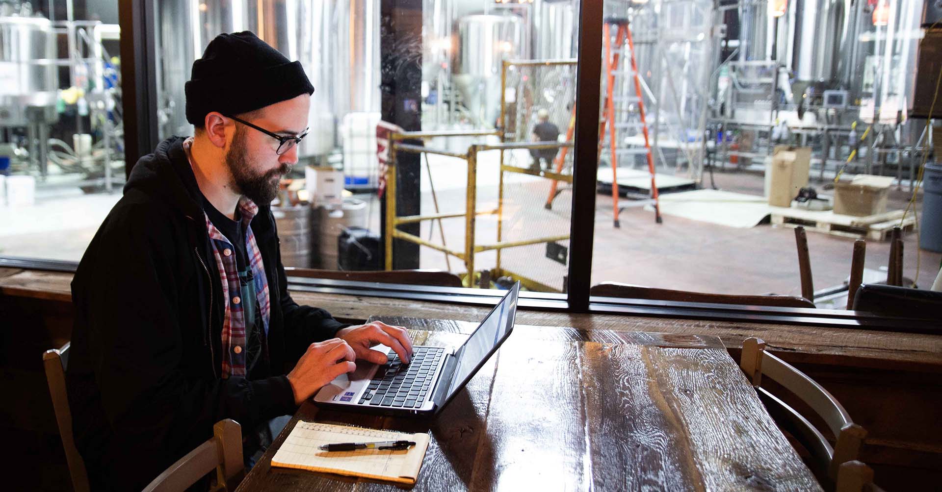 brewery employee using a computer