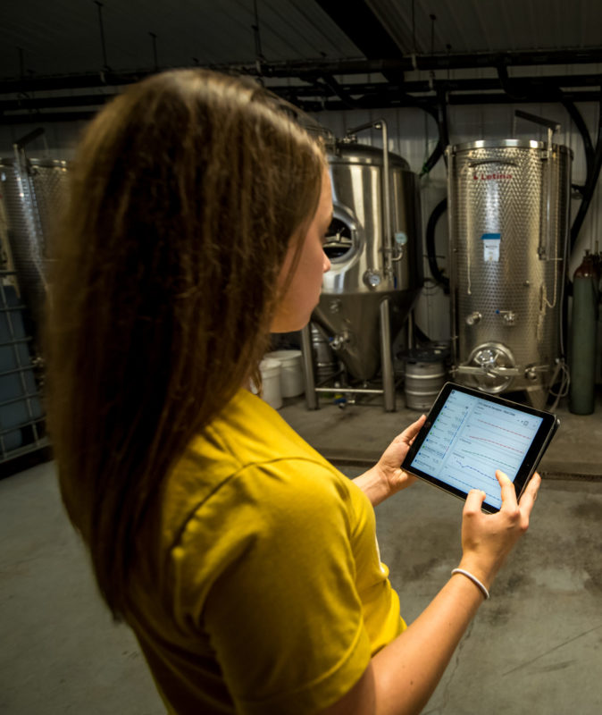 Woman using the Ekos interface on an iPad