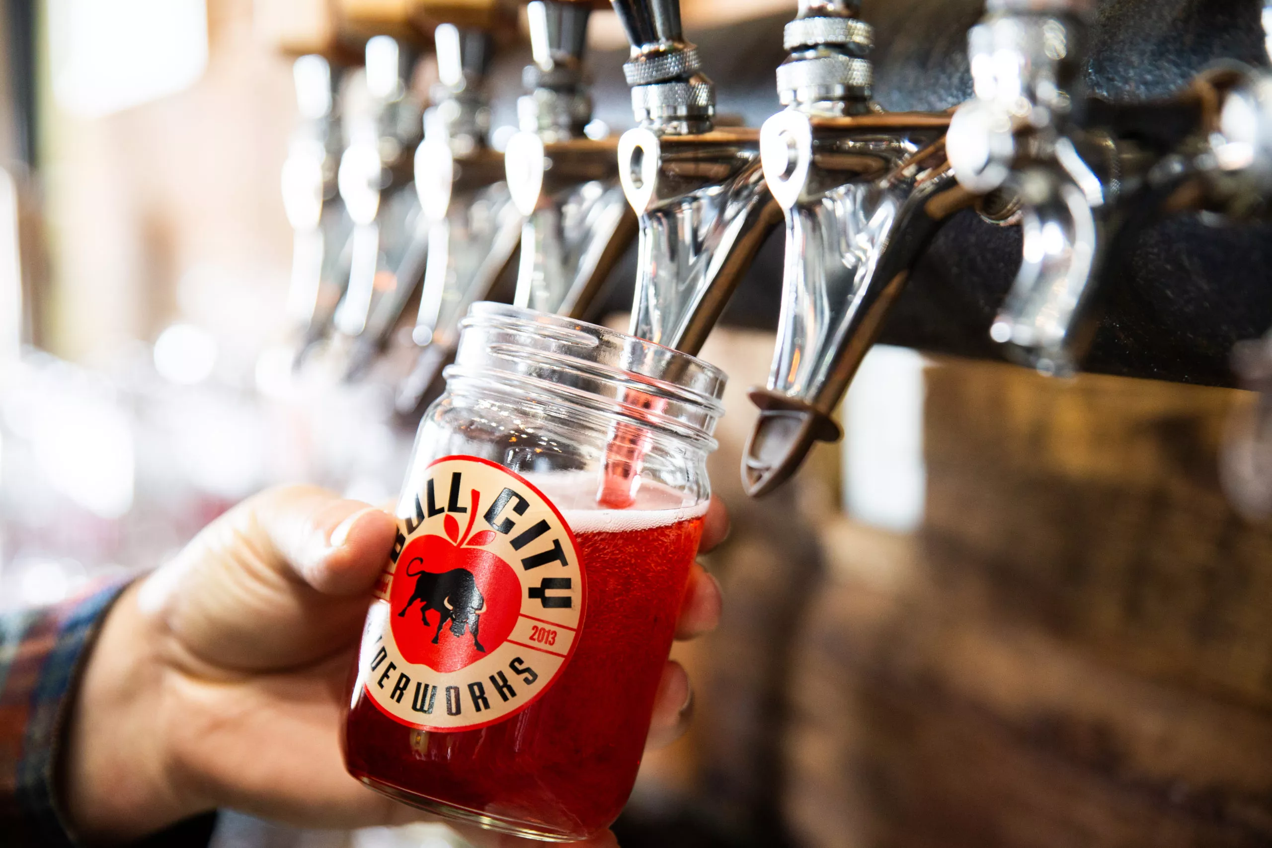 cider being poured at bull city ciderworks