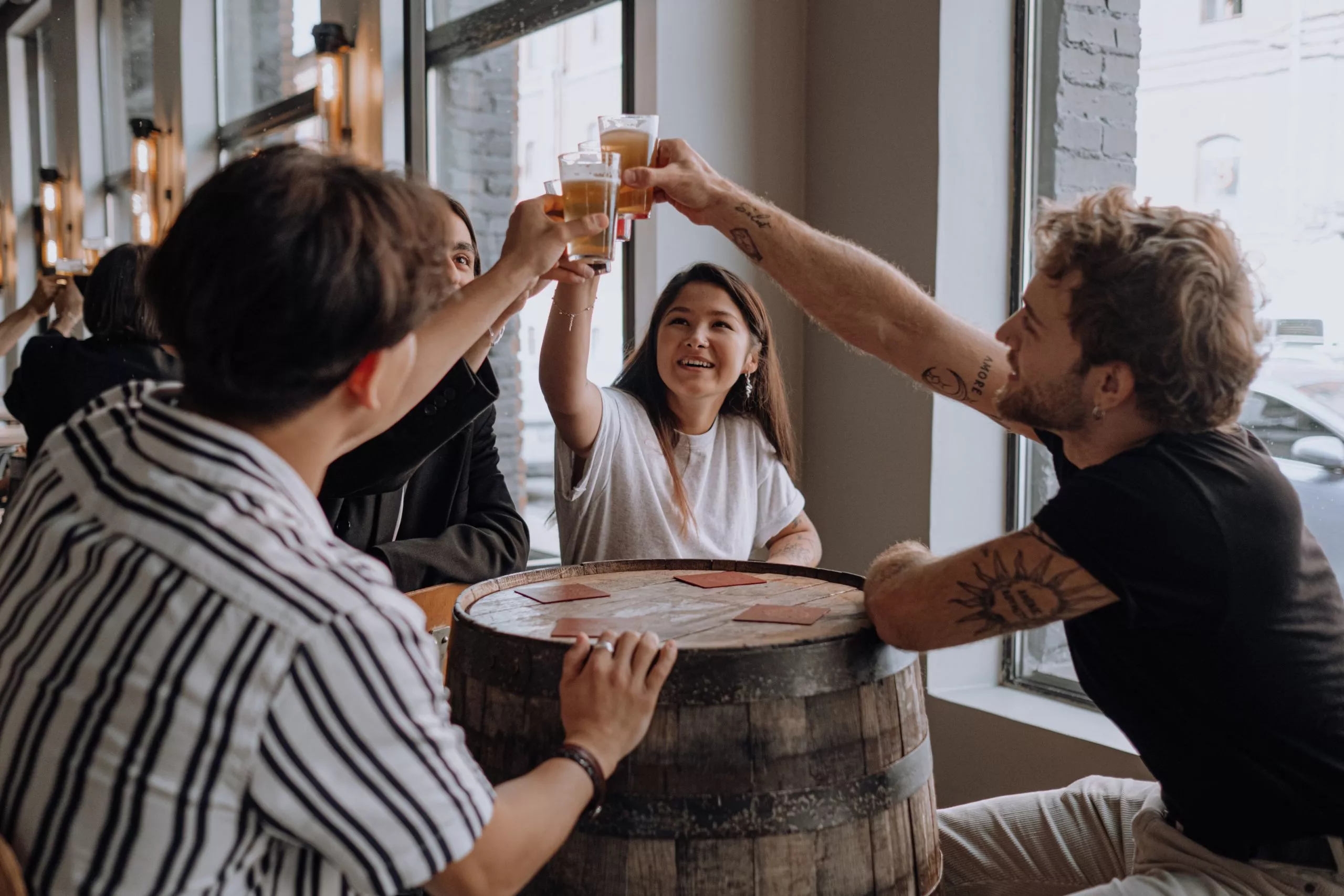 patrons enjoying a beer at a brewery